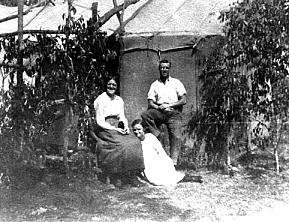 The Cox hessian home, 1918, with Jane, Bert and May Cox seated by the door. (Photo: Cox/Morgan)