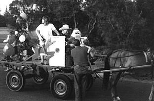 Today the old village camaraderie is still evident. Fred Bell, 'Bottlo' since he was 15 years old, is seen here taking Santa Claus (June Jacobs) around Kurnell at Christmas time to give sweets and other small gifts to the children. In recent years the Kurnell Rural Bushfire Brigade has taken over Fred's Christmas rounds. (Photo: Fred Bell)