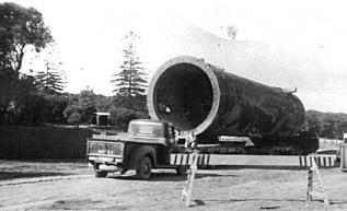 A large pipe, part of the refinery's cracking plant, being transported on a low-loader along Polo Street, now Captain Cook Drive, to the refinery. Both ends of this pipe had been sealed in order to float and tow it from Sydney by tug. (Photo: George Blundell)