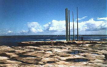 Potter Point, with its five unsightly vents, is where Sydney Water's Sewage Treatment Plant discharges effluent into the ocean, creating a health risk for nearby swimmers. This photograph looks south from the point across Boat Harbour to Cronulla beaches, 1999.